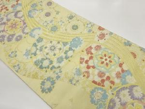 丸に花々・曲線模様織出し袋帯